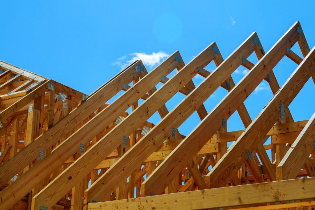 wooden roof construction, symbolic photo for home, house building, and house financing